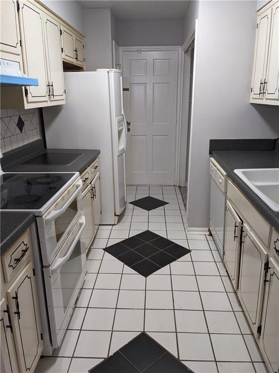 kitchen featuring white appliances, ventilation hood, backsplash, sink, and light tile floors