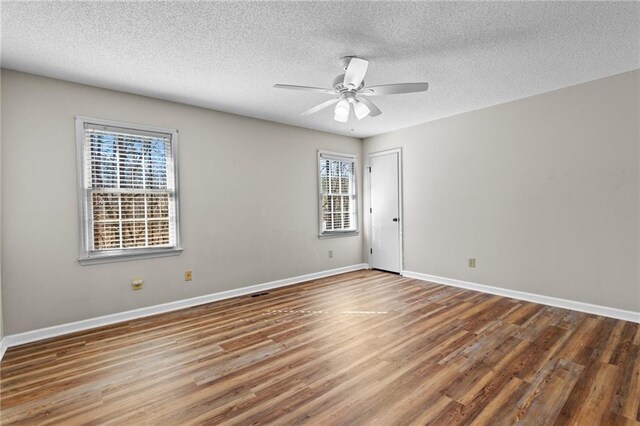 6165 Picketts Rdg NW, Acworth, GA 30101 - unfurnished room featuring a ceiling fan, wood finished floors, baseboards, and a textured ceiling
