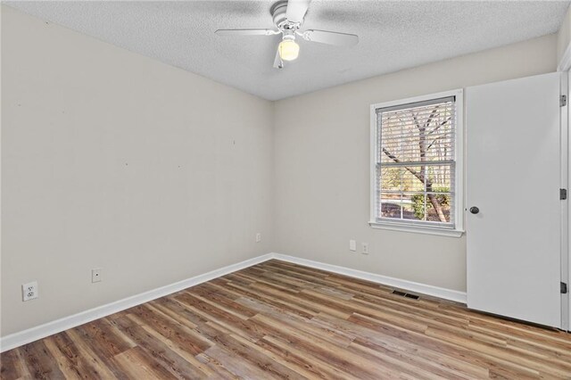 6165 Picketts Rdg NW, Acworth, GA 30101 - empty room featuring ceiling fan, baseboards, a textured ceiling, and wood finished floors