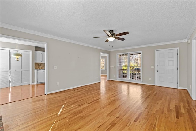 6165 Picketts Rdg NW, Acworth, GA 30101 - unfurnished living room featuring crown molding, baseboards, light wood-style floors, a textured ceiling, and a ceiling fan