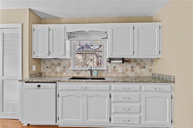 6165 Picketts Rdg NW, Acworth, GA 30101 - kitchen with white cabinetry, white dishwasher, and a sink