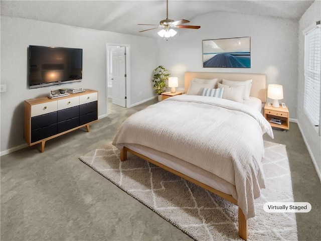 carpeted bedroom featuring ceiling fan and vaulted ceiling