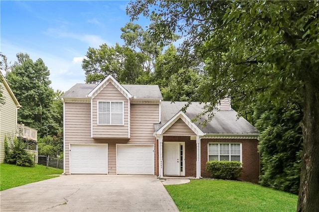 4245 Brandy Ann Dr, Acworth, GA 30101 - view of front facade featuring a front yard, an attached garage, fence, brick siding, and driveway