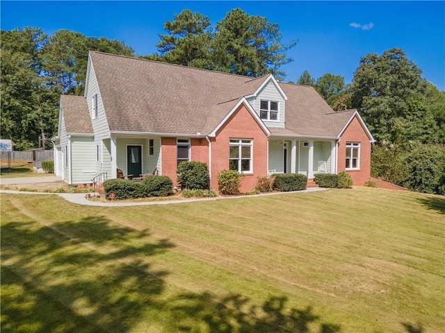 cape cod-style house featuring a front lawn