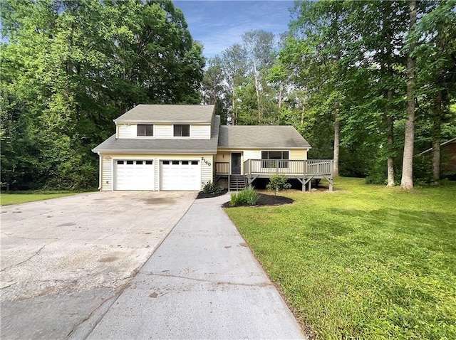 2140 Fern Valley Dr SW, Atlanta, GA 30331 - view of property featuring a garage, a wooden deck, and a front yard
