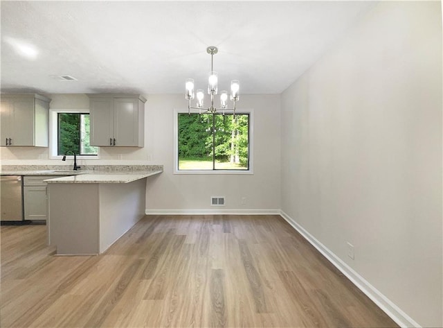 2140 Fern Valley Dr SW, Atlanta, GA 30331 - kitchen featuring gray cabinets, decorative light fixtures, dishwasher, light stone countertops, and light wood-type flooring