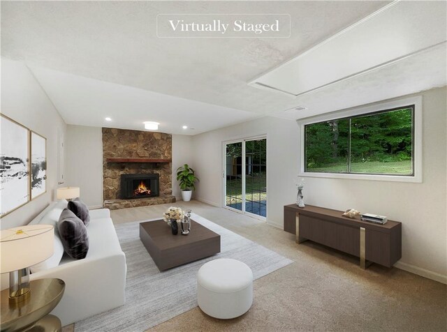 2140 Fern Valley Dr SW, Atlanta, GA 30331 - living room featuring a healthy amount of sunlight, light carpet, and a fireplace