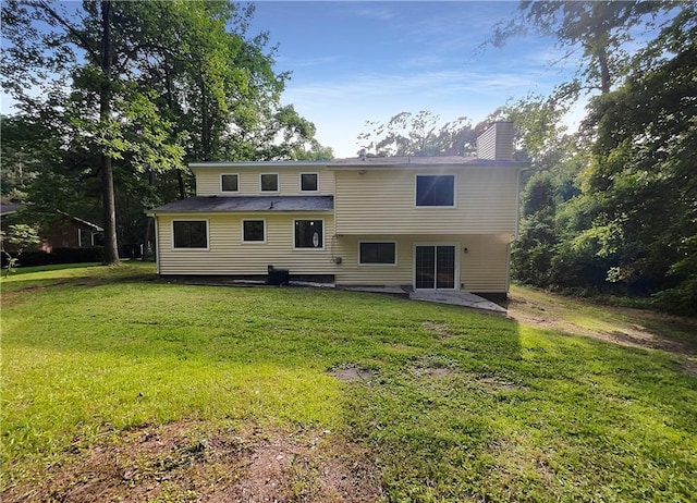 2140 Fern Valley Dr SW, Atlanta, GA 30331 - rear view of house featuring a yard and a patio