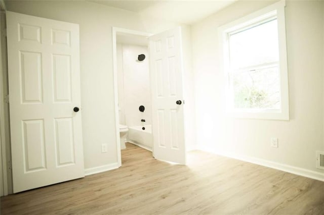 unfurnished bedroom with light hardwood / wood-style flooring