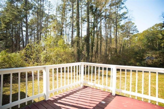 deck featuring a lawn