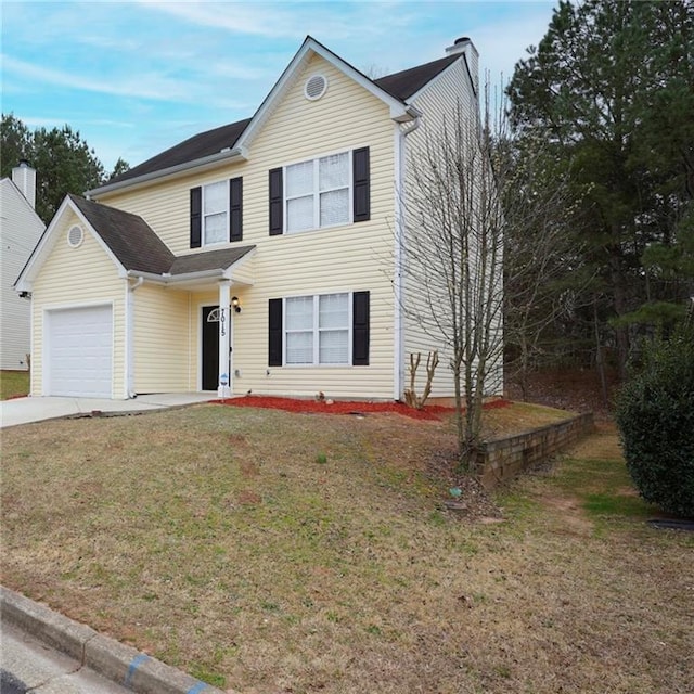 traditional home featuring concrete driveway, a front lawn, and an attached garage