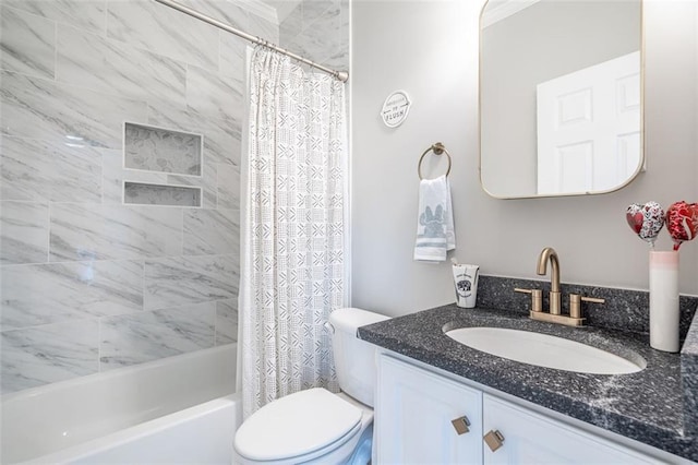 full bath with toilet, vanity, and shower / bath combo with shower curtain