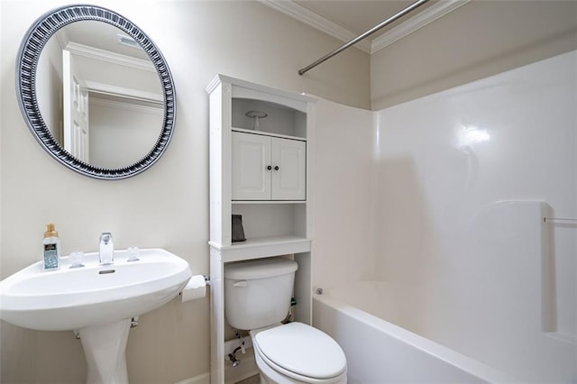bathroom with toilet, ornamental molding, shower / tub combination, and baseboards