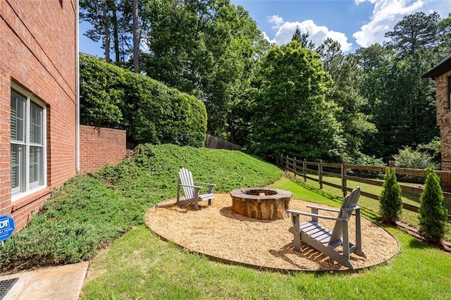 view of yard with an outdoor fire pit
