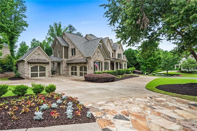 771 Tate Overlook, Marietta, GA 30064 - view of front of house with stone siding, driveway, and a garage