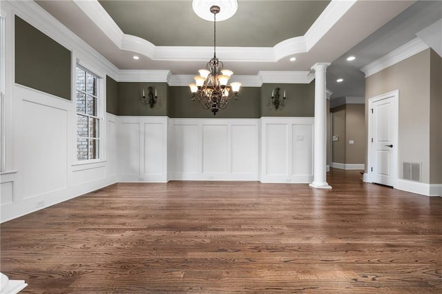 771 Tate Overlook, Marietta, GA 30064 - unfurnished dining area with a decorative wall, ornamental molding, wood finished floors, a raised ceiling, and a chandelier
