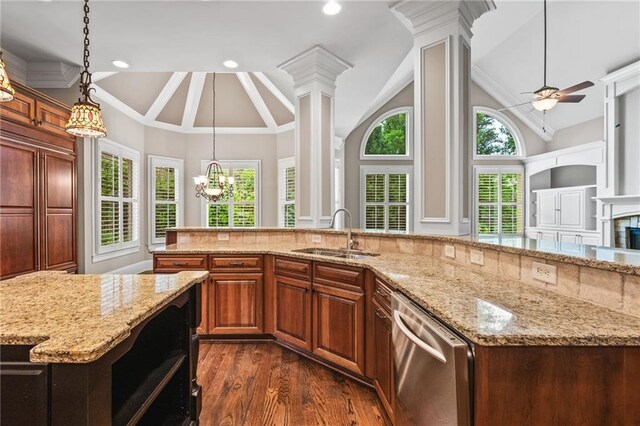 771 Tate Overlook, Marietta, GA 30064 - kitchen featuring stainless steel dishwasher, a sink, a kitchen island with sink, ornate columns, and lofted ceiling