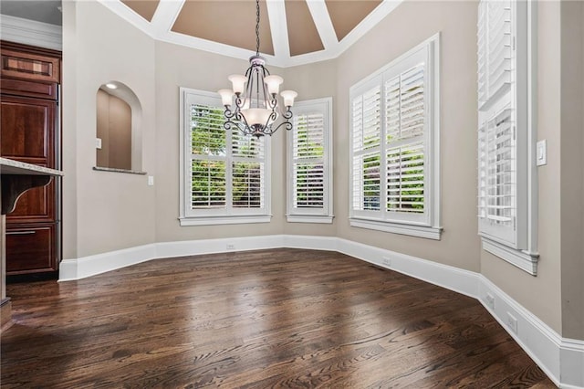 771 Tate Overlook, Marietta, GA 30064 - unfurnished dining area featuring a chandelier, dark wood-type flooring, healthy amount of natural light, crown molding, and baseboards