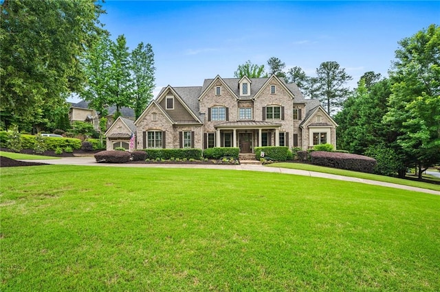 771 Tate Overlook, Marietta, GA 30064 - french provincial home featuring a front yard, a standing seam roof, and stone siding