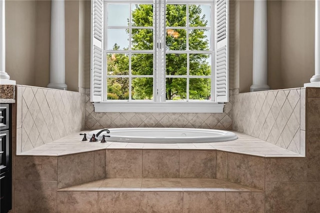 771 Tate Overlook, Marietta, GA 30064 - bathroom with decorative columns, a bath, toilet, and vanity