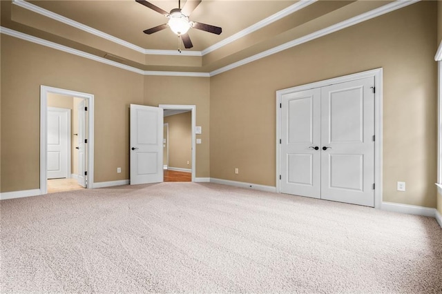 771 Tate Overlook, Marietta, GA 30064 - unfurnished bedroom with ornamental molding, light carpet, a closet, a raised ceiling, and baseboards