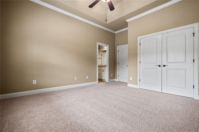 771 Tate Overlook, Marietta, GA 30064 - unfurnished bedroom with crown molding, carpet flooring, baseboards, a closet, and ceiling fan