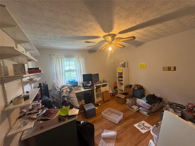 713 Pine Chase Ct, Lawrenceville, GA 30043 - office area featuring ceiling fan, light wood-style flooring, and a textured ceiling