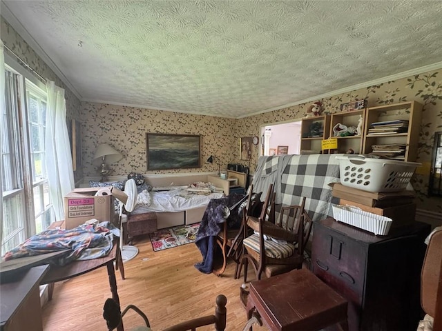 713 Pine Chase Ct, Lawrenceville, GA 30043 - bedroom featuring wallpapered walls, wood finished floors, crown molding, and a textured ceiling