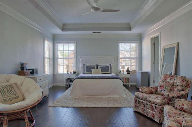 401 Iona Abbey Ct Unit 6, Smyrna, GA 30082 - bedroom with multiple windows, dark wood-style flooring, a raised ceiling, crown molding, and a ceiling fan