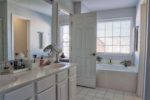 401 Iona Abbey Ct Unit 6, Smyrna, GA 30082 - bathroom featuring a garden tub, double vanity, tile patterned floors, and plenty of natural light