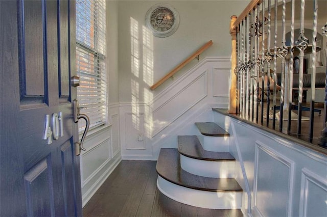 401 Iona Abbey Ct Unit 6, Smyrna, GA 30082 - foyer entrance featuring a decorative wall, dark wood-style flooring, wainscoting, and stairs