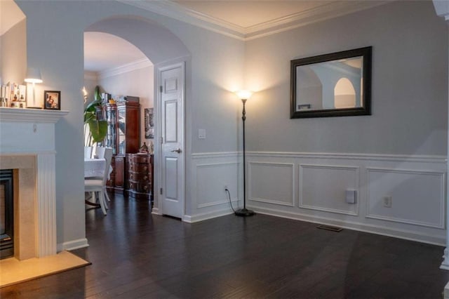 401 Iona Abbey Ct Unit 6, Smyrna, GA 30082 - unfurnished dining area with dark wood-type flooring, wainscoting, a high end fireplace, crown molding, and arched walkways