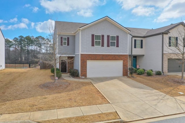 view of front facade featuring a garage, concrete driveway, and brick siding