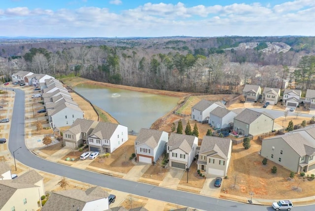 birds eye view of property featuring a residential view and a water view