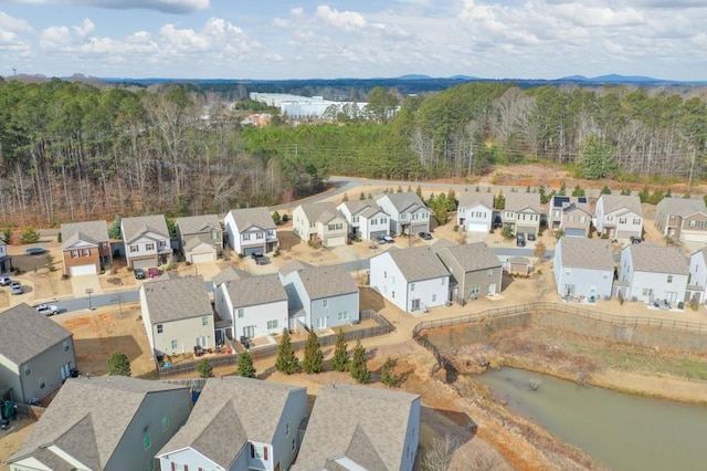 aerial view featuring a water view and a residential view