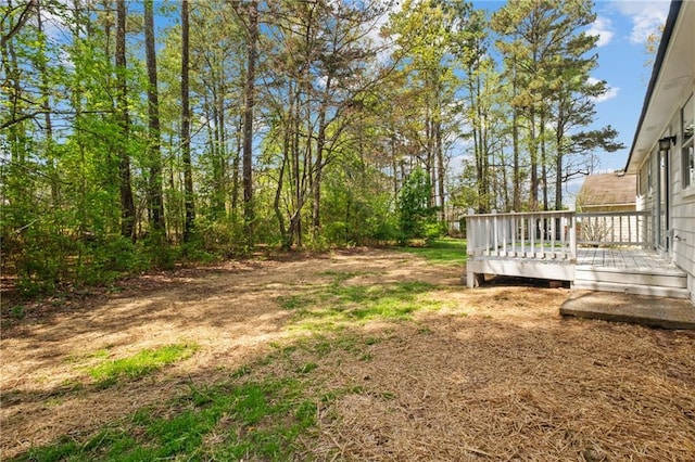 view of yard featuring a wooden deck