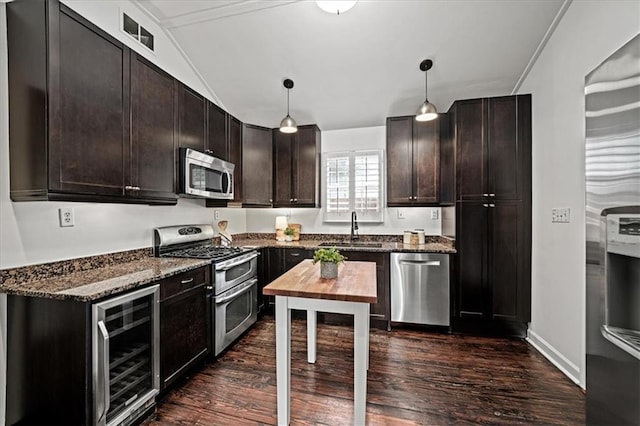 1734 8th St, Brookhaven, GA 30341 - kitchen with beverage cooler, appliances with stainless steel finishes, dark stone countertops, dark wood-style floors, and dark brown cabinetry