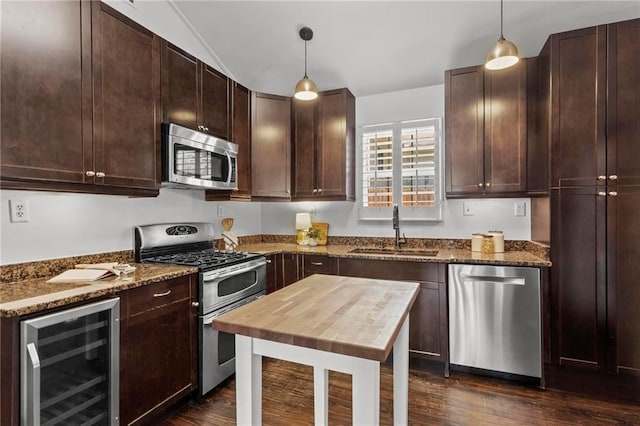 1734 8th St, Brookhaven, GA 30341 - kitchen featuring stainless steel appliances, wine cooler, dark wood-style floors, dark stone counters, and vaulted ceiling