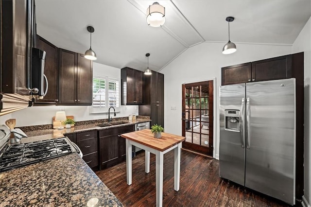 1734 8th St, Brookhaven, GA 30341 - kitchen featuring appliances with stainless steel finishes, dark wood-style flooring, dark brown cabinets, vaulted ceiling, and dark stone countertops