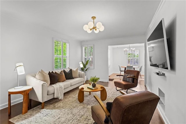 1734 8th St, Brookhaven, GA 30341 - living area with a chandelier, crown molding, healthy amount of natural light, and wood finished floors