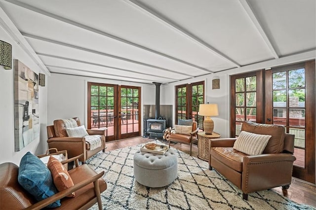 1734 8th St, Brookhaven, GA 30341 - living area featuring french doors, a wood stove, light wood-style flooring, and beamed ceiling