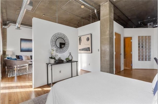 bedroom with wood finished floors