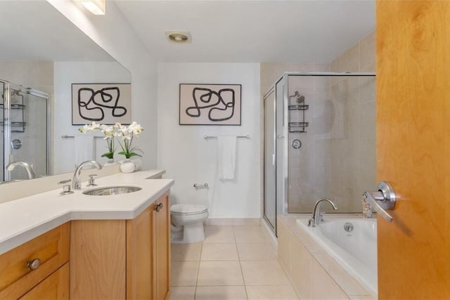 full bathroom featuring tile patterned flooring, a shower stall, and vanity