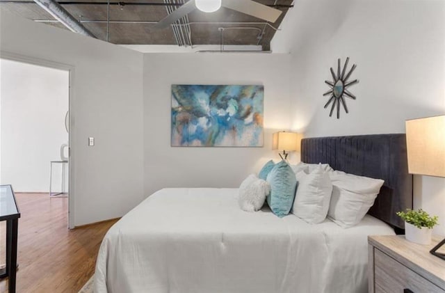 bedroom featuring wood finished floors