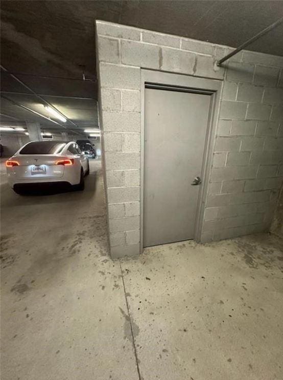 garage featuring concrete block wall