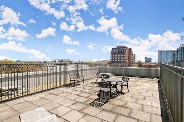 view of patio / terrace with a city view