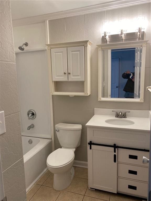 full bathroom featuring tile patterned flooring, shower / bathing tub combination, toilet, vanity, and ornamental molding