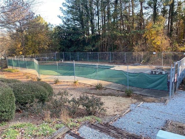 view of pool featuring tennis court