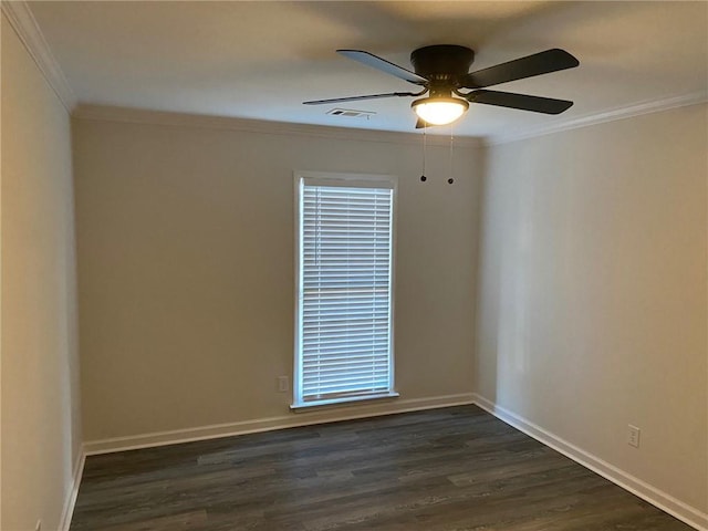 spare room featuring ceiling fan, crown molding, and dark wood-type flooring