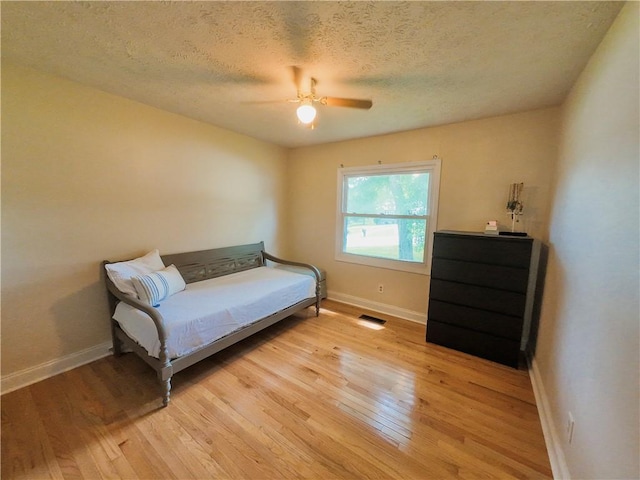 3905 Hunt Dr SE, Gainesville, GA 30507 - sitting room with light wood-type flooring, ceiling fan, and a textured ceiling
